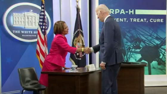 Lisa Cooper shakes hands with President Joe Biden