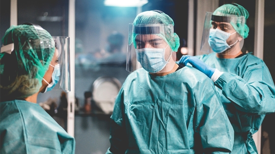 Medical and public health preparedness and response, Medical workers getting dressed inside clinic, by DisobeyArt