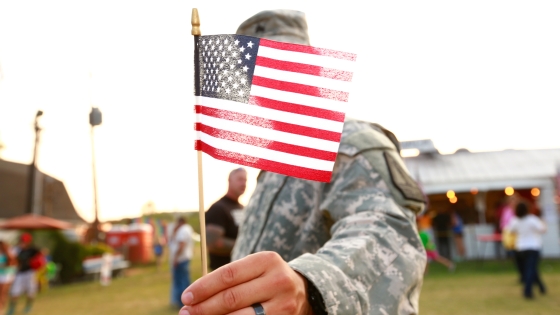 Veteran holding an American flag