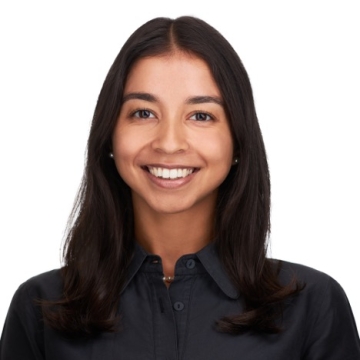 Headshot of HPM Research Associate Ilina Odouard wearing a black collared shirt and sporting an open mouth smile