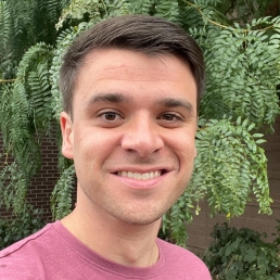 Man standing in front of tree