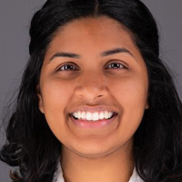 Woman with dark hair smiling