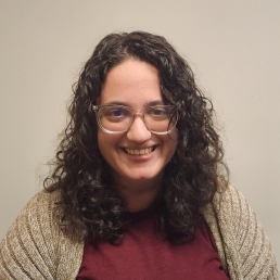 Woman with glasses wearing a sweater