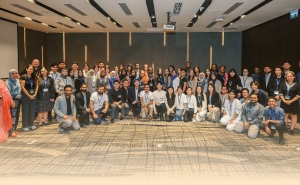 A large group of participants ages 19–35 gather for a group photo during the Ascend 2024 in-person workshop