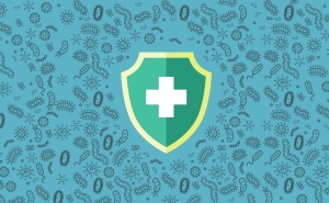 Green shield with white medical cross in the center of a teal background illustrated with hundreds of microbes