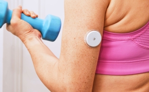 image of woman lifting a dumbbell