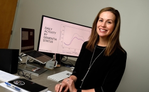 Dr. Jennifer Schrack sitting at desk