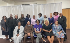 Group of men and women sitting and standing