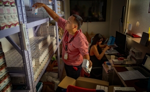 A pharmacist stocks PrEP medicine at a pharmacy in a community center operated by LoveYourself, a nonprofit impacted by the Trump administration&#039;s freeze on foreign aid, on February 19, 2025, in Mandaluyong, Metro Manila, Philippines