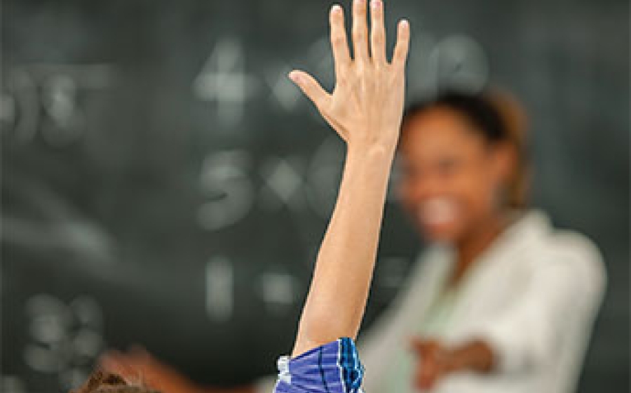 Then: The Good Behavior Game - a child raising his hand