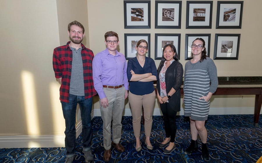 Jennifer Kavran stands with four of her trainees