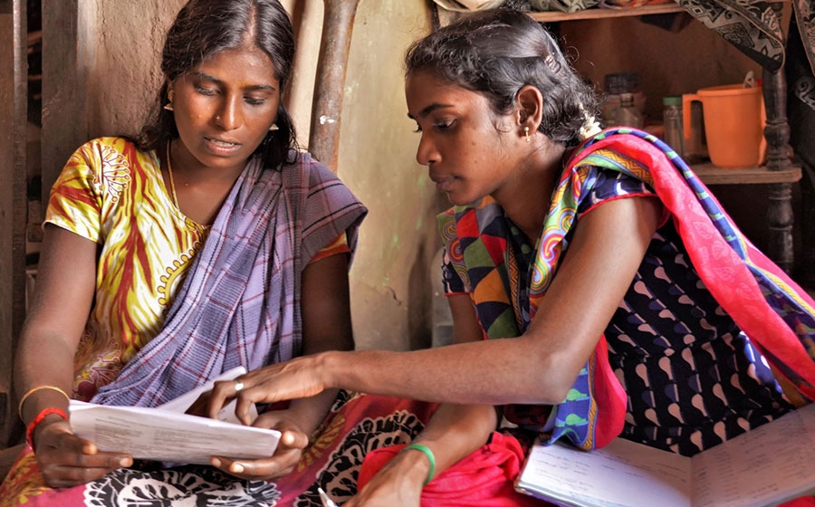 Woman consulting with another woman.