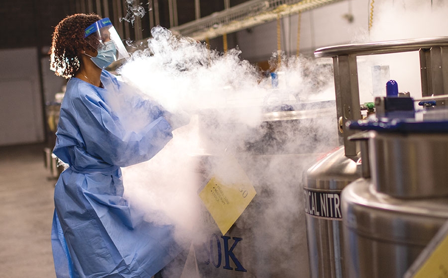 Researcher in cryo chamber.