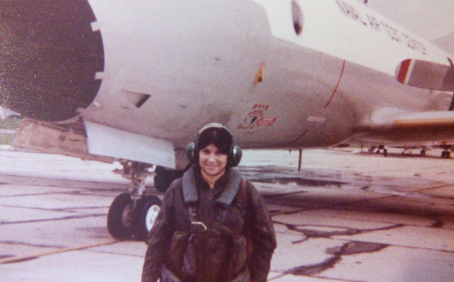 Gertrude Huster suited up for a pre-flight check in front of a P3-C aircraft, circa 1979.