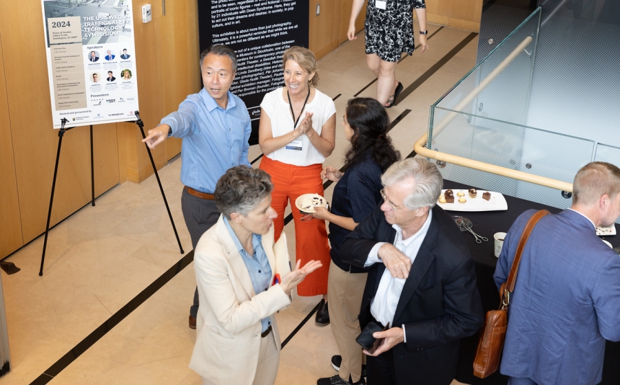 Two groups of people having a conversation.