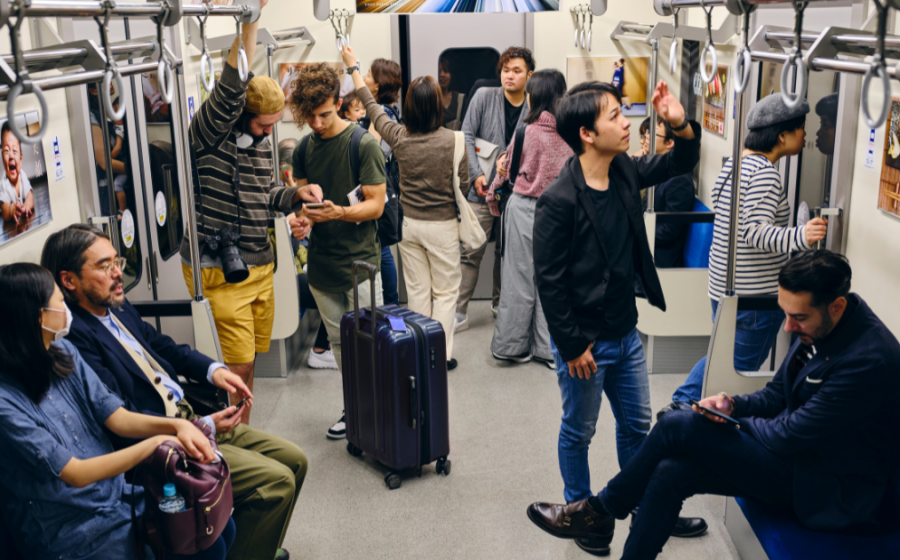 Group of people riding in a subway car