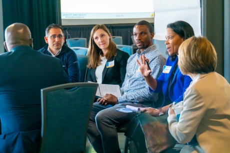Participants gather in small groups 
