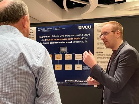 Jeff Hardesty shares his poster at the 2023 SRNT meeting