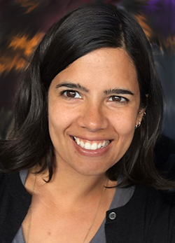 A dark-haired, smiling Latina woman