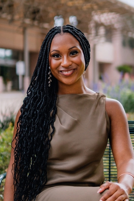 Taylor Montgomery seated outside