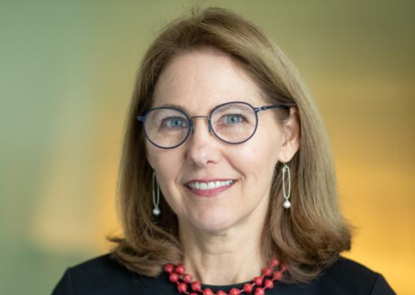 Martha Ruffin, white woman with light hair wearing glasses and a black shirt