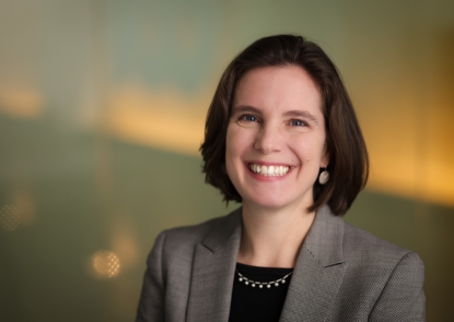 Dr. Liz Selvin smiles for a professional photo at the Bloomberg School of Public Health.