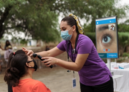 healthworker assessing patient with telemedicine intervention 