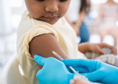 photo of young girl getting vaccinated