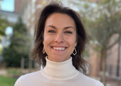 head shot of a woman in a white turtleneck